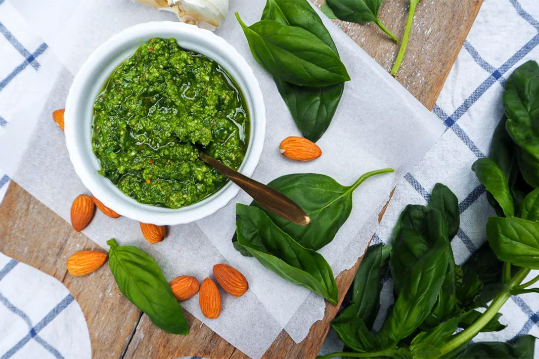 A bowl of Rosie's green pesto on a table