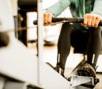 person using rowing machine